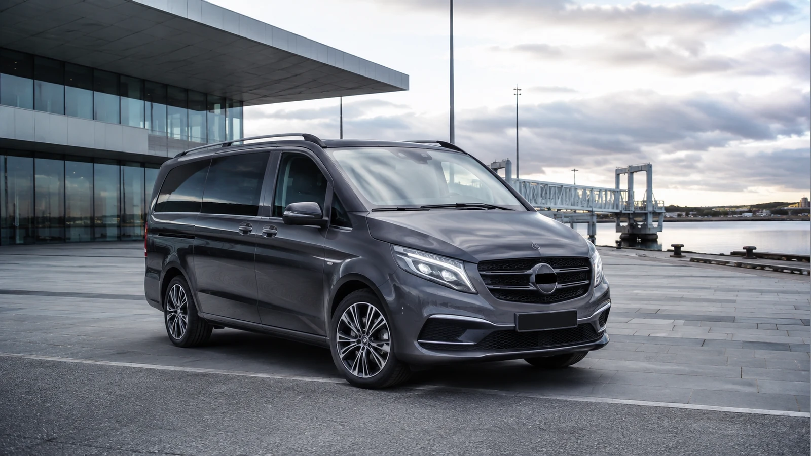Premium private transfer van outside a modern passenger port