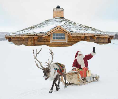 Santa Claus and reindeer in snowy Finland