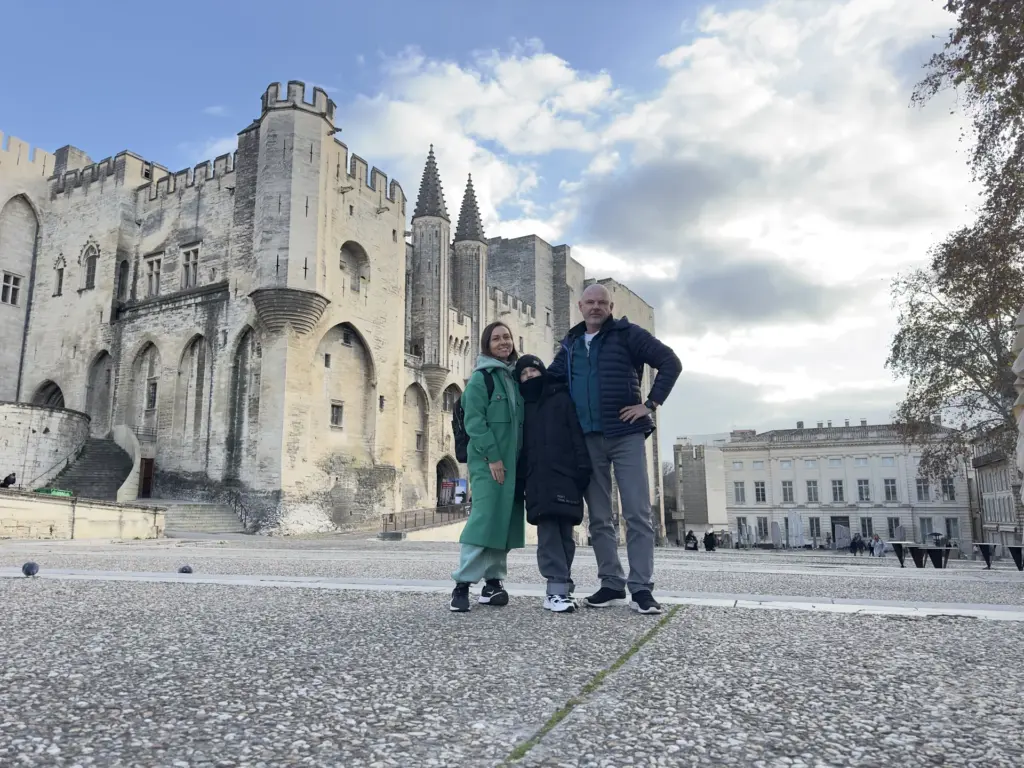 Family in front of a historic palace during a private trip