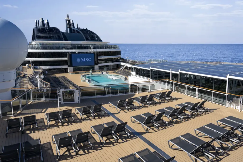 MSC ship deck with a swimming pool and sun loungers